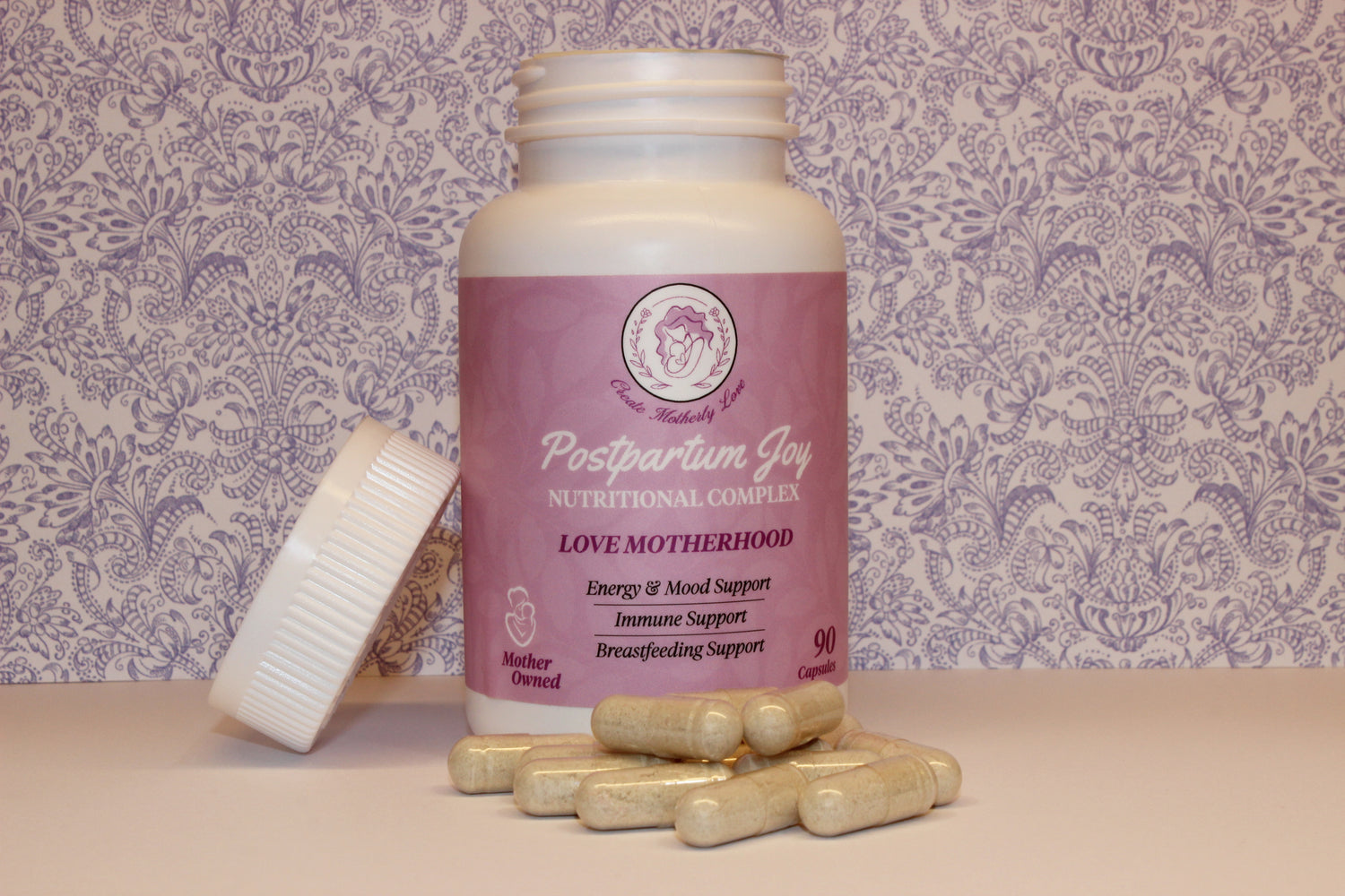 Supplement bottle labeled 'Postpartum Joy' with capsules on a patterned background