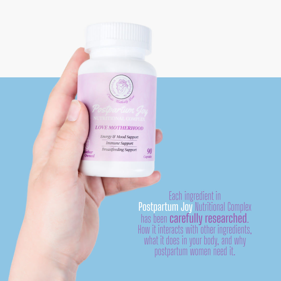 Hand holding a bottle of 'Postpartum Joy' nutritional complex against a blue background