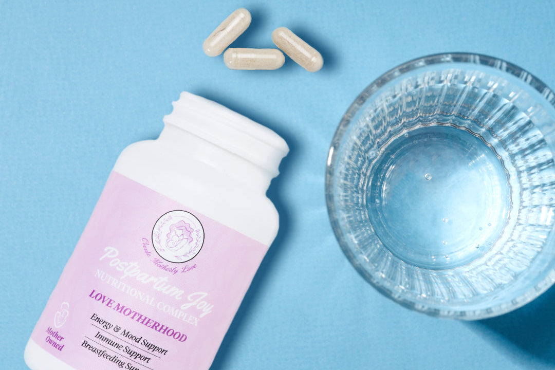 Supplement bottle with capsules and a glass of water on a blue background